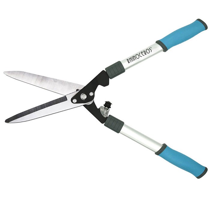 Användningen av trädgårdsredskap - höga grensaxar och höga grensågar